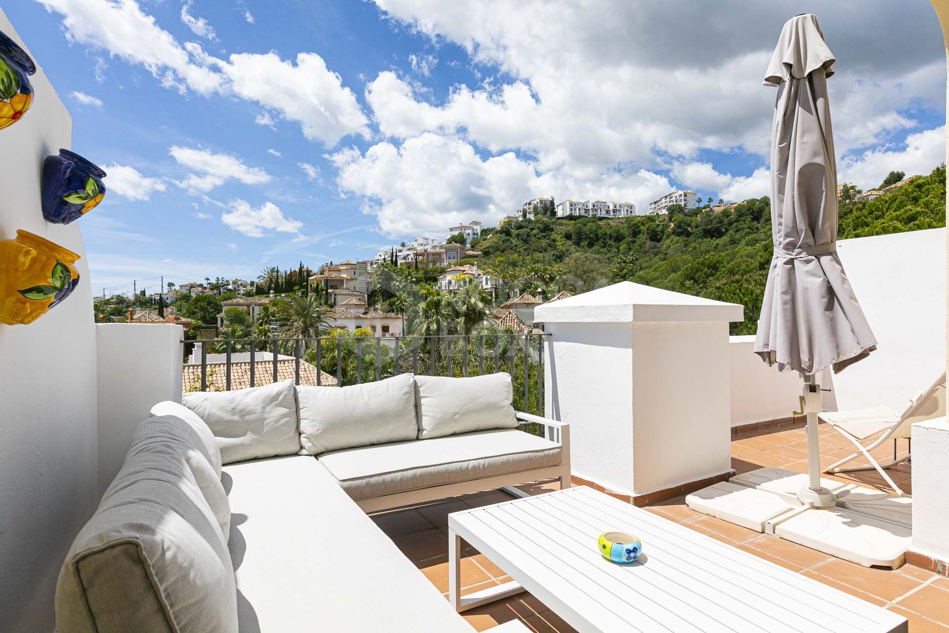 Beautiful south-facing, four bedroom townhouse in Los Almendros, part of the secure Los Arqueros Golf community in Benahavís