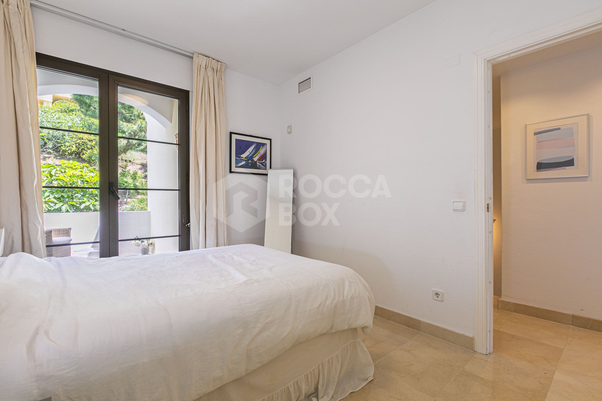 Beautiful south-facing, four bedroom townhouse in Los Almendros, part of the secure Los Arqueros Golf community in Benahavís