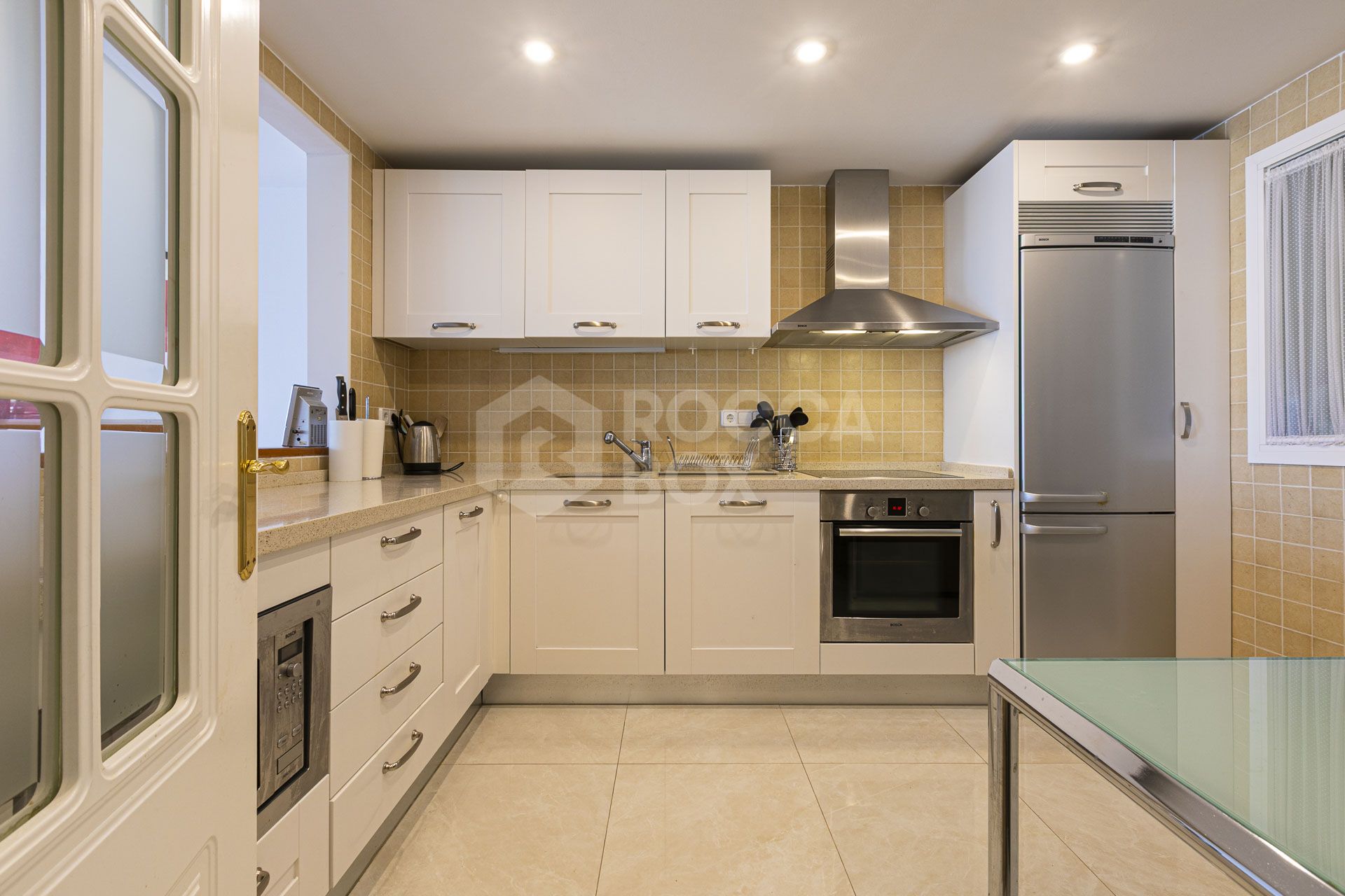 Beautiful south-facing, four bedroom townhouse in Los Almendros, part of the secure Los Arqueros Golf community in Benahavís