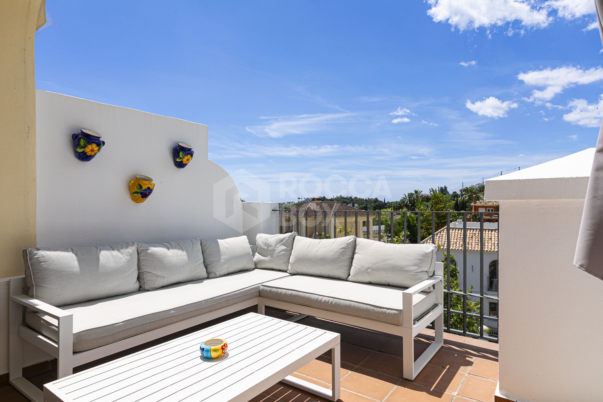 Beautiful south-facing, four bedroom townhouse in Los Almendros, part of the secure Los Arqueros Golf community in Benahavís