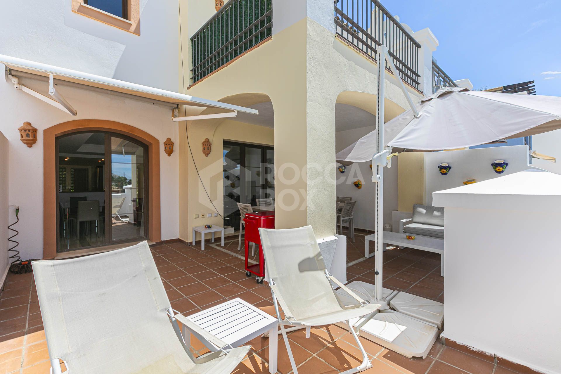 Beautiful south-facing, four bedroom townhouse in Los Almendros, part of the secure Los Arqueros Golf community in Benahavís