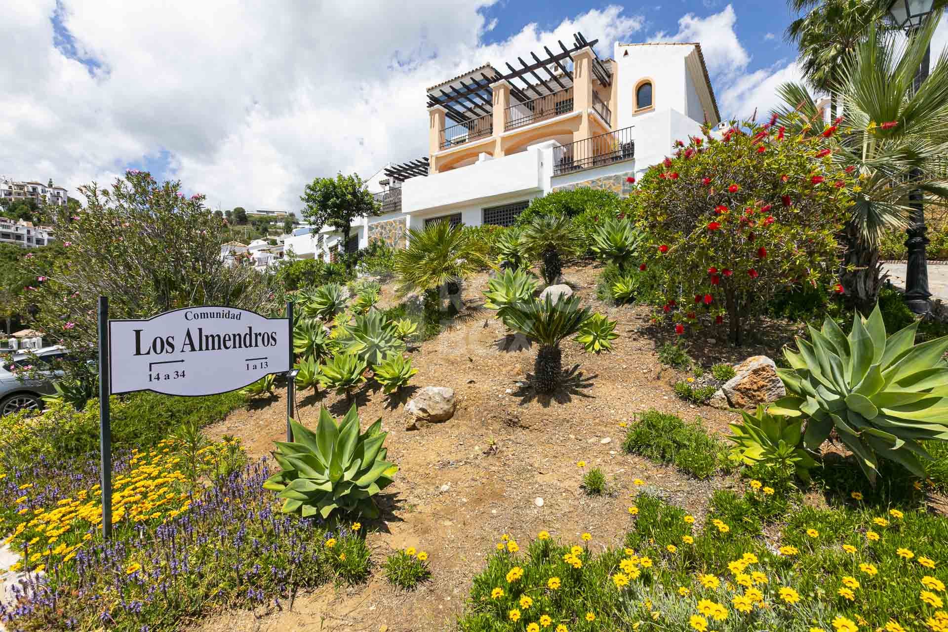 Beautiful south-facing, four bedroom townhouse in Los Almendros, part of the secure Los Arqueros Golf community in Benahavís