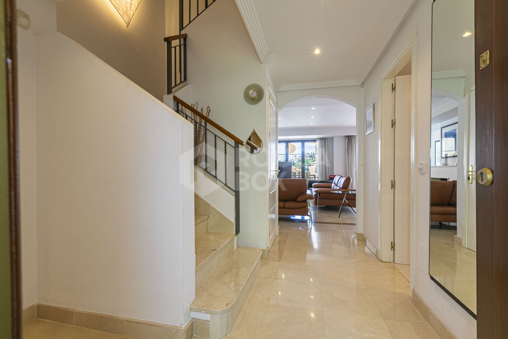 Beautiful south-facing, four bedroom townhouse in Los Almendros, part of the secure Los Arqueros Golf community in Benahavís