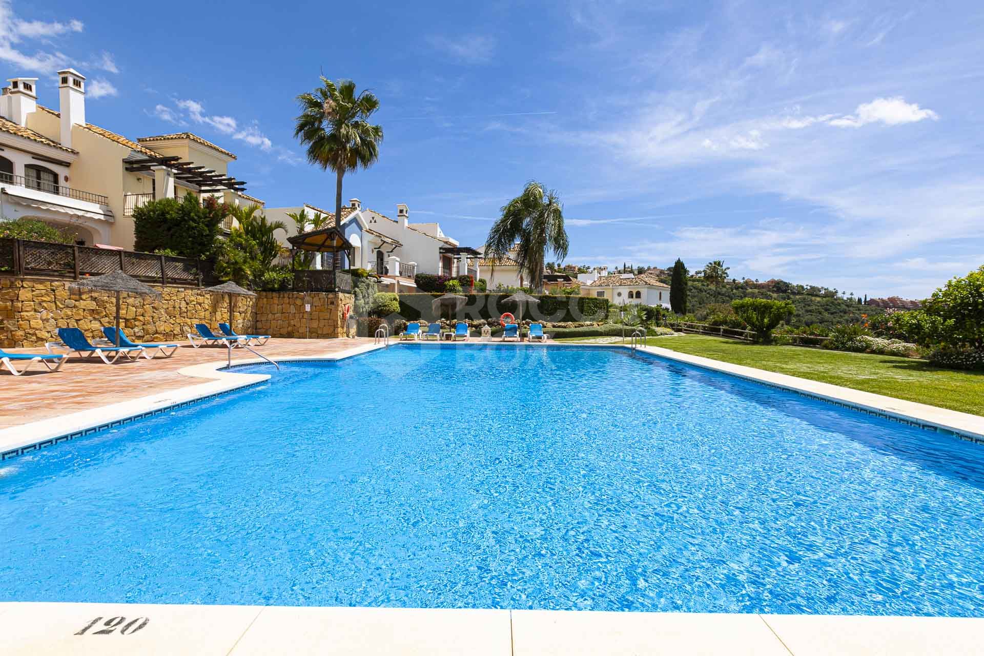 Beautiful south-facing, four bedroom townhouse in Los Almendros, part of the secure Los Arqueros Golf community in Benahavís