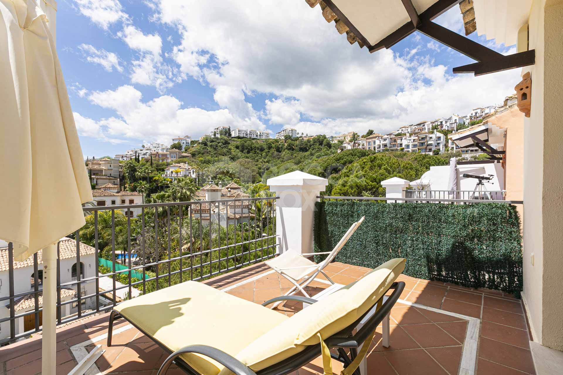 Beautiful south-facing, four bedroom townhouse in Los Almendros, part of the secure Los Arqueros Golf community in Benahavís