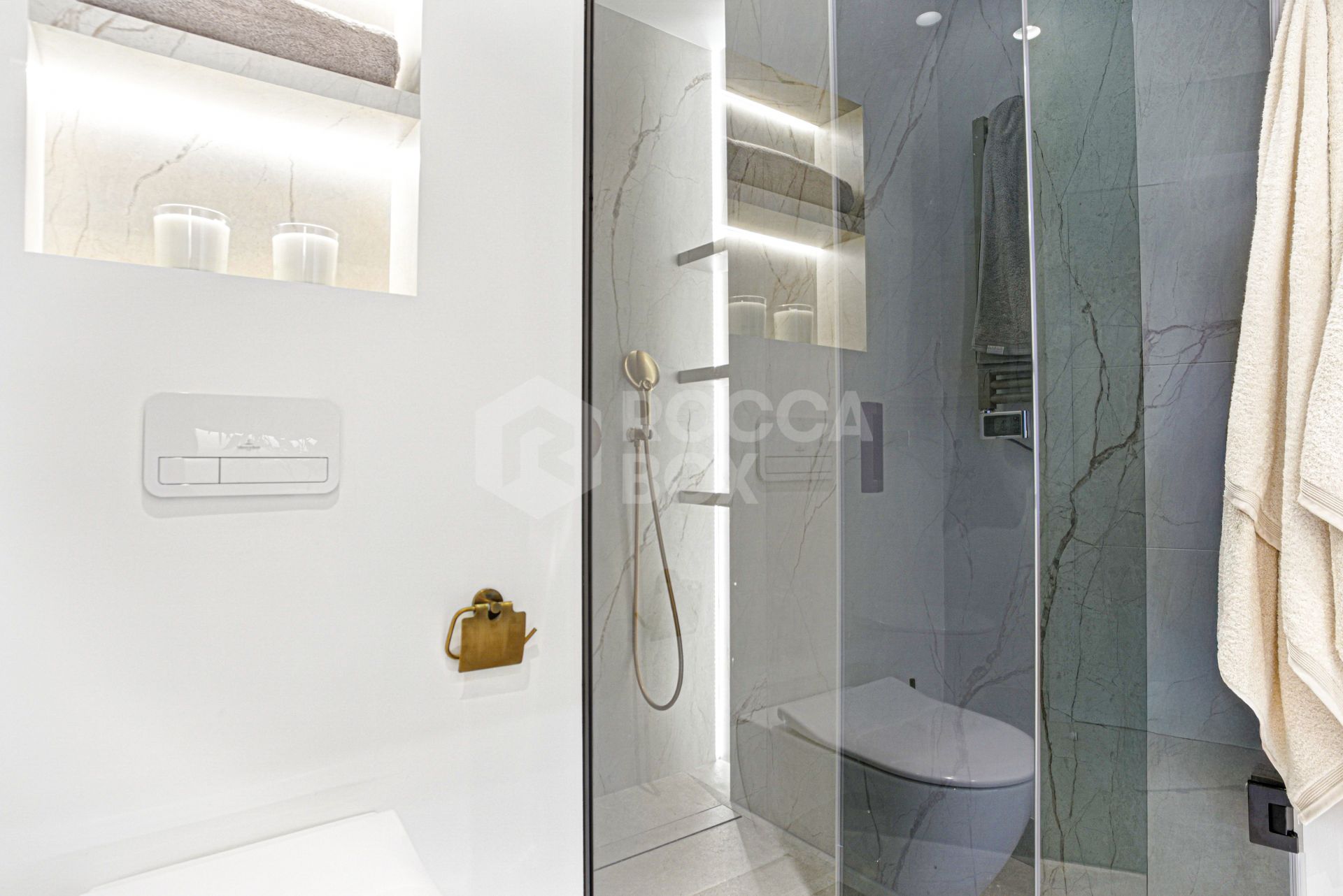 Impeccably renovated, south facing beach front, garden apartment located in the exclusive Menara Beach community on the sought-after New Golden Mile