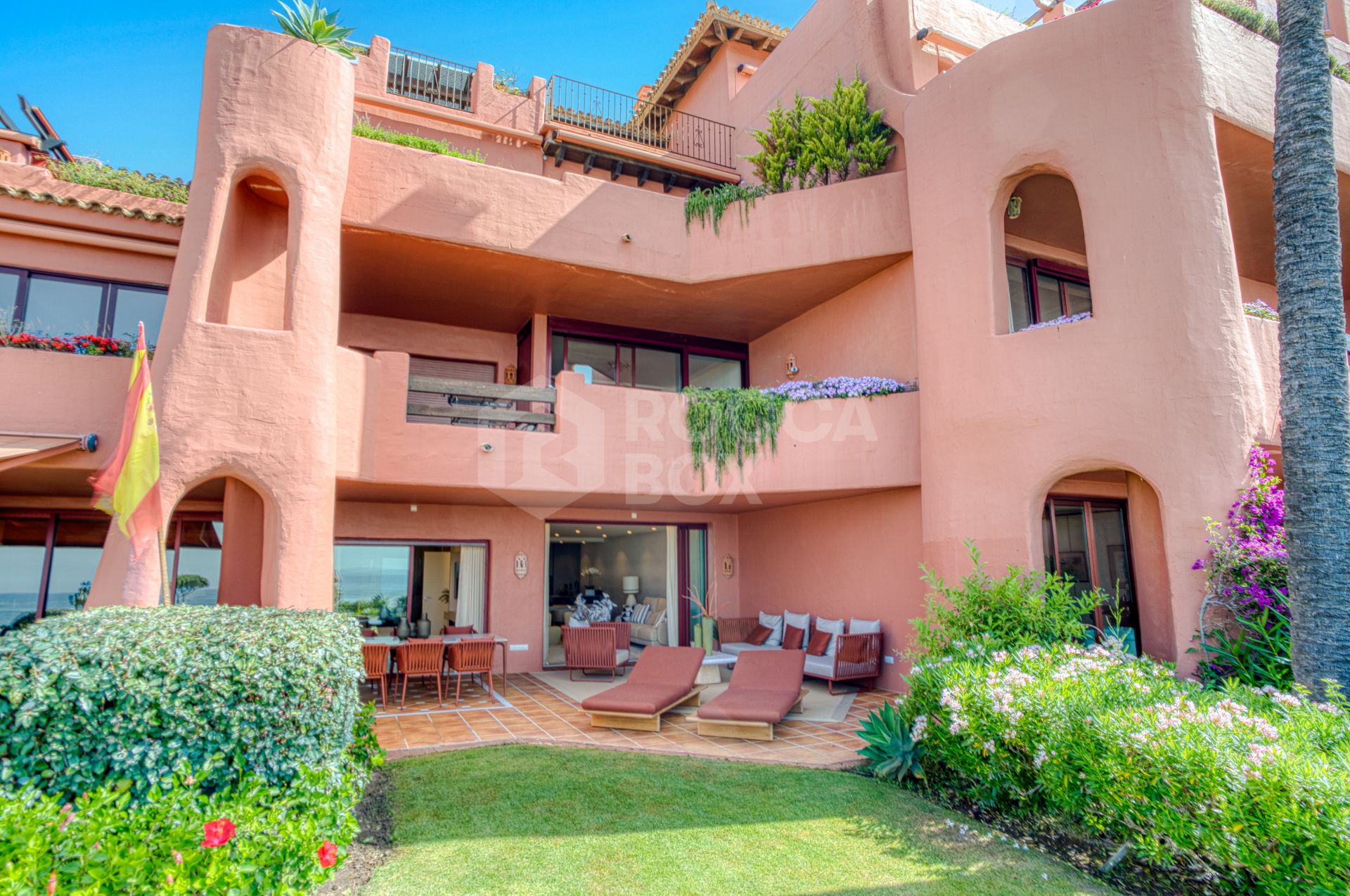 Impeccably renovated, south facing beach front, garden apartment located in the exclusive Menara Beach community on the sought-after New Golden Mile