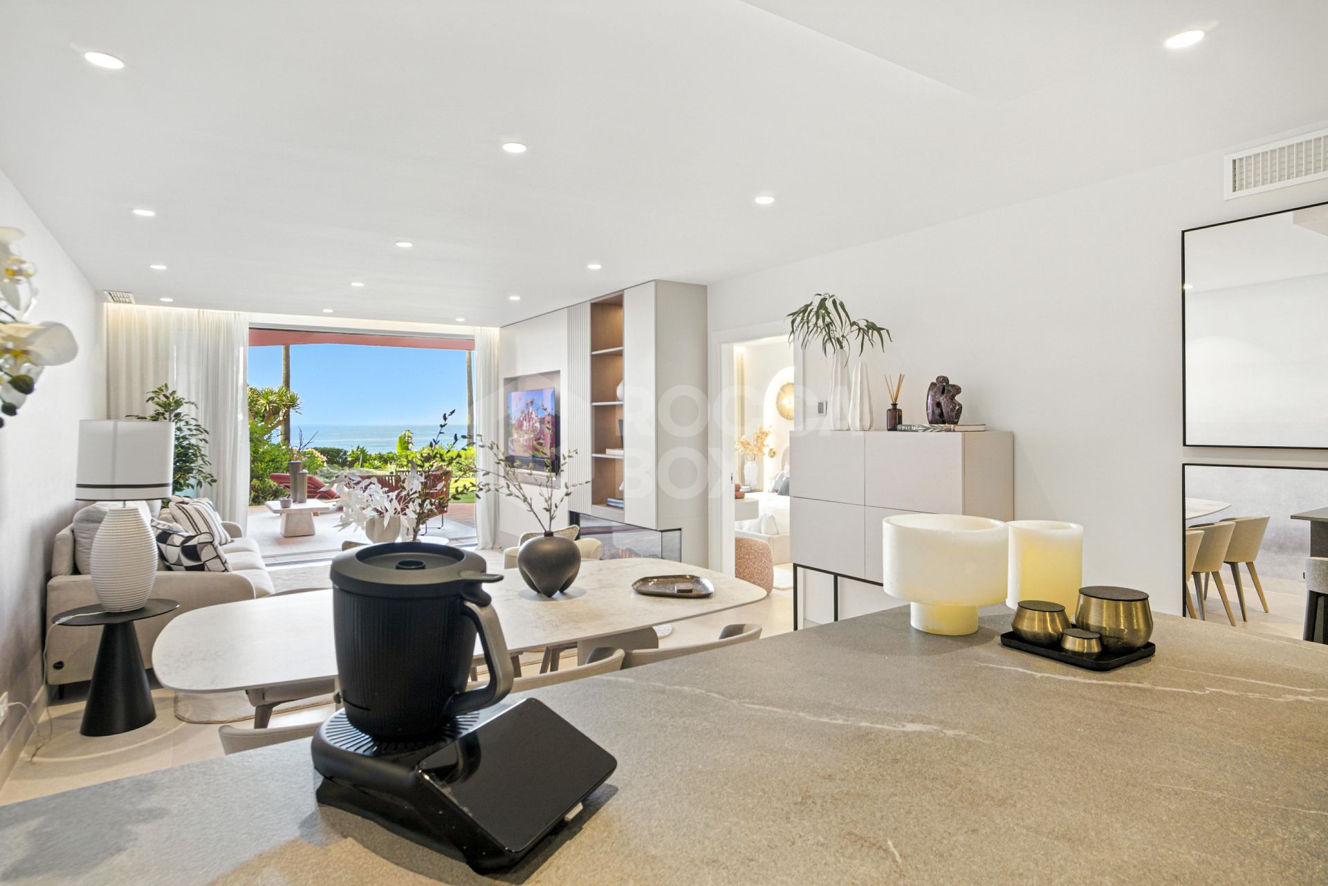 Impeccably renovated, south facing beach front, garden apartment located in the exclusive Menara Beach community on the sought-after New Golden Mile