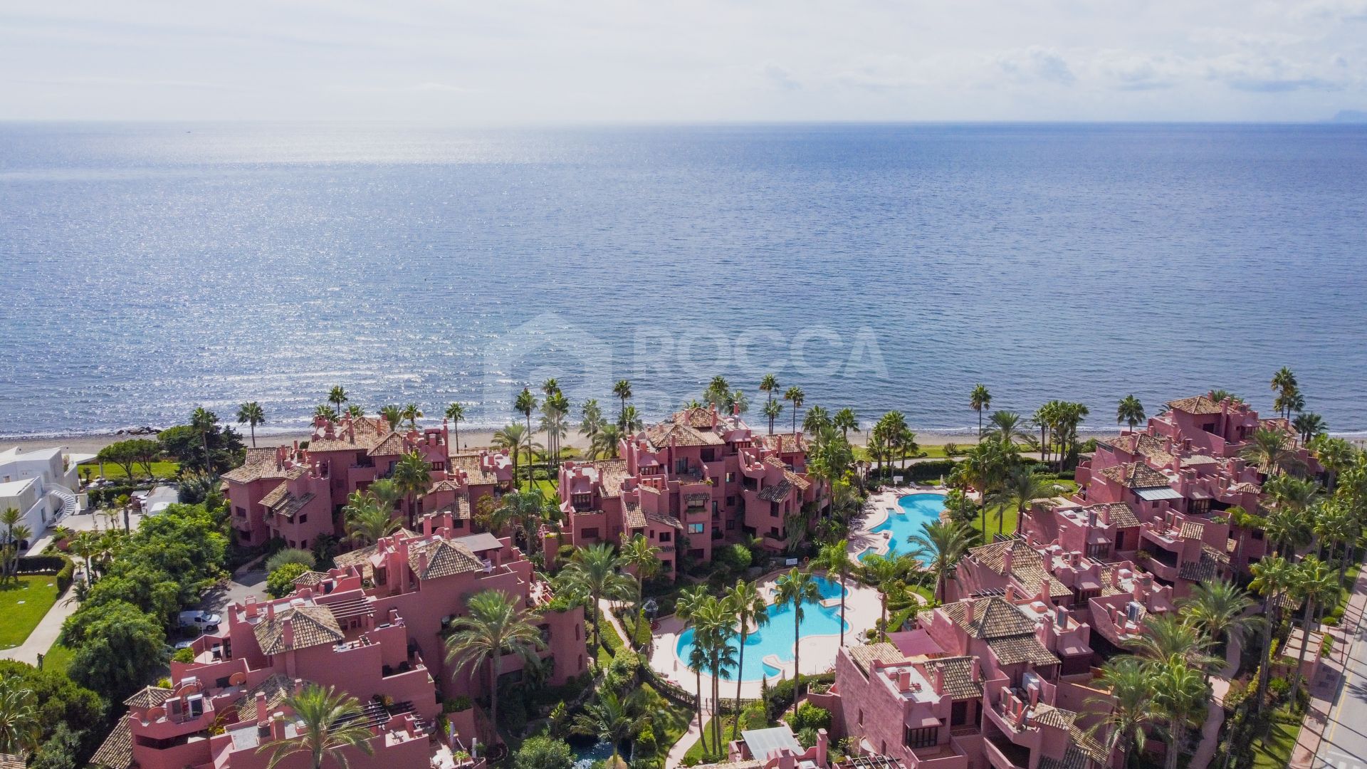 Impeccably renovated, south facing beach front, garden apartment located in the exclusive Menara Beach community on the sought-after New Golden Mile