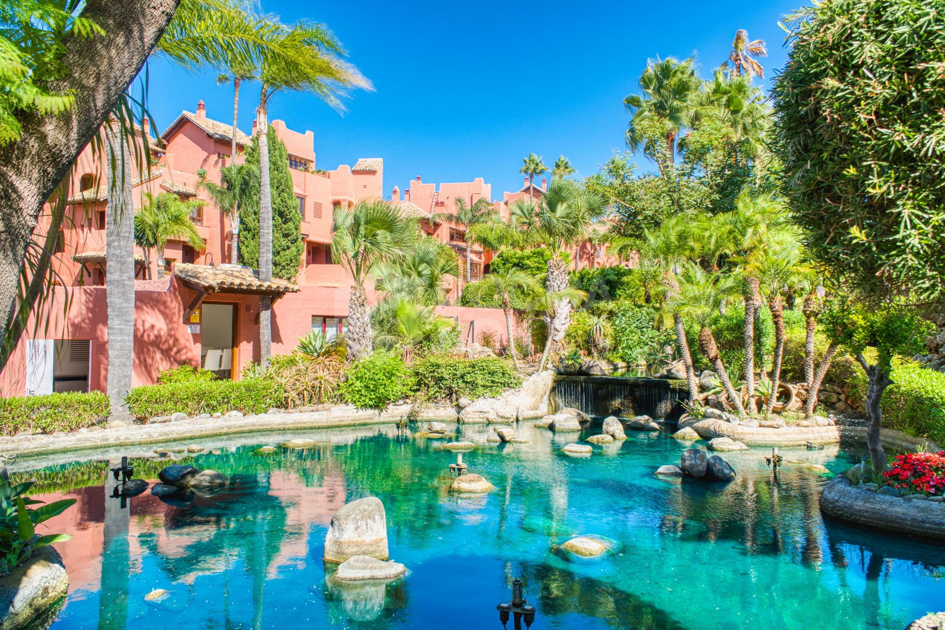 Impeccably renovated, south facing beach front, garden apartment located in the exclusive Menara Beach community on the sought-after New Golden Mile