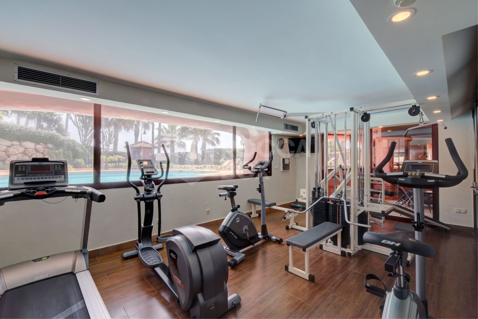 Impeccably renovated, south facing beach front, garden apartment located in the exclusive Menara Beach community on the sought-after New Golden Mile