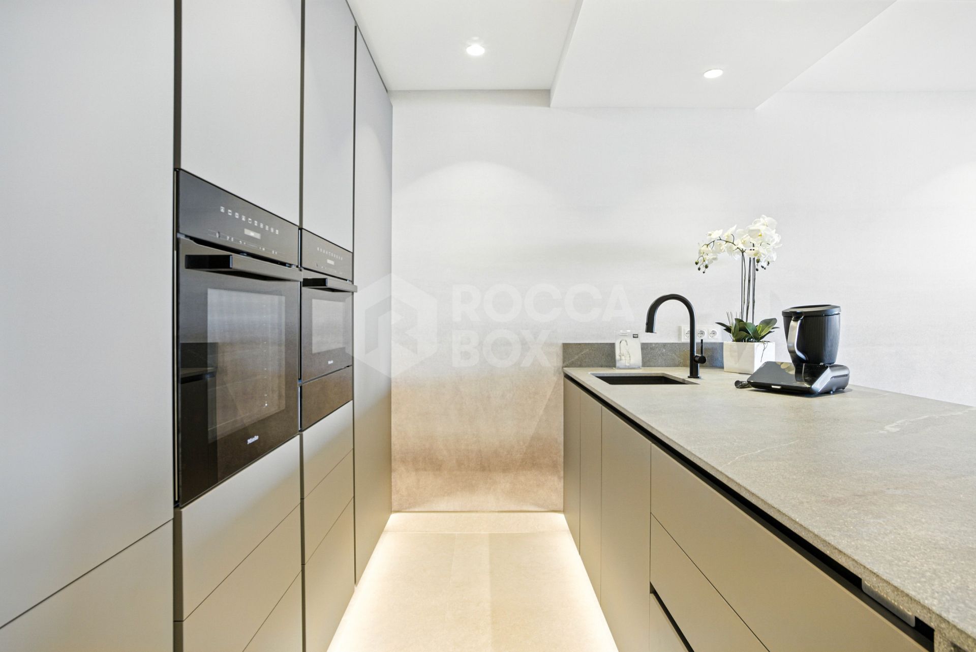 Impeccably renovated, south facing beach front, garden apartment located in the exclusive Menara Beach community on the sought-after New Golden Mile