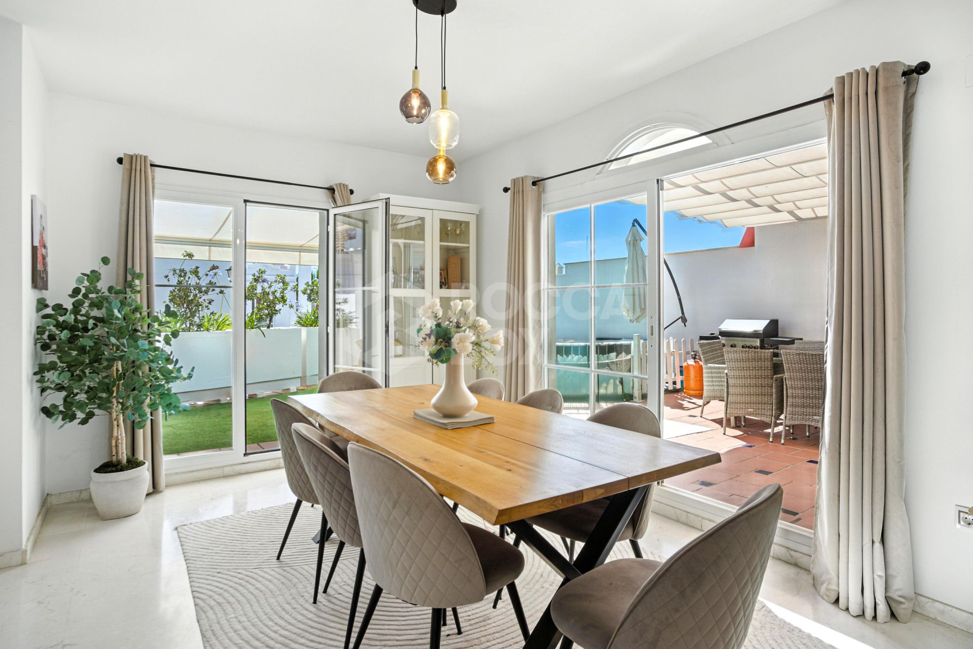 Stylish south west facing, three-bedroom semi detached townhouse located in Riviera del Sol