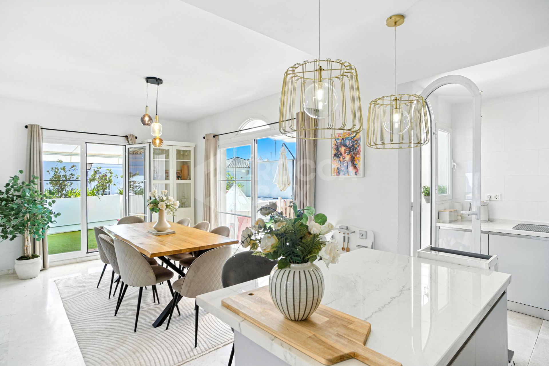 Stylish south west facing, three-bedroom semi detached townhouse located in Riviera del Sol