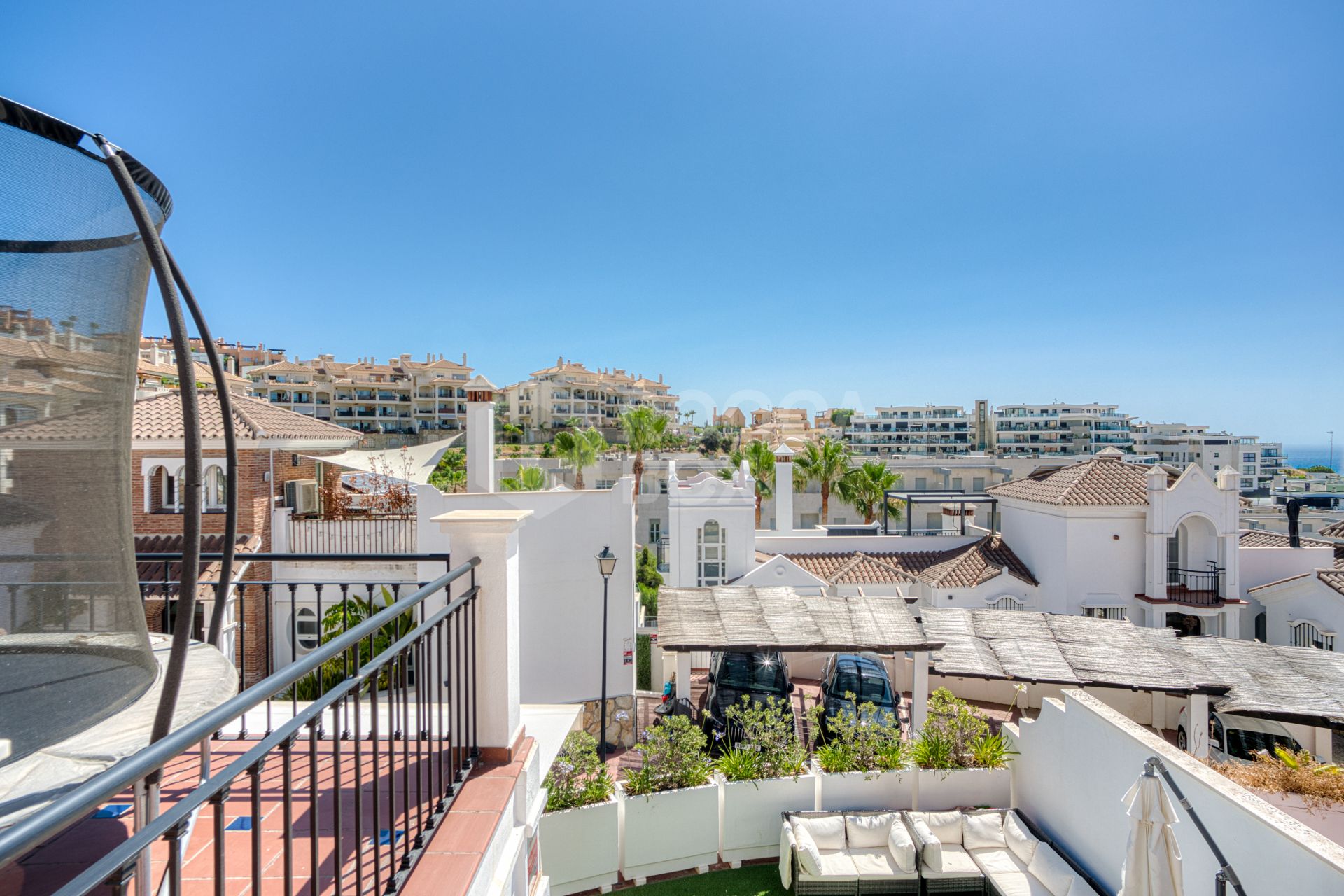 Stylish south west facing, three-bedroom semi detached townhouse located in Riviera del Sol