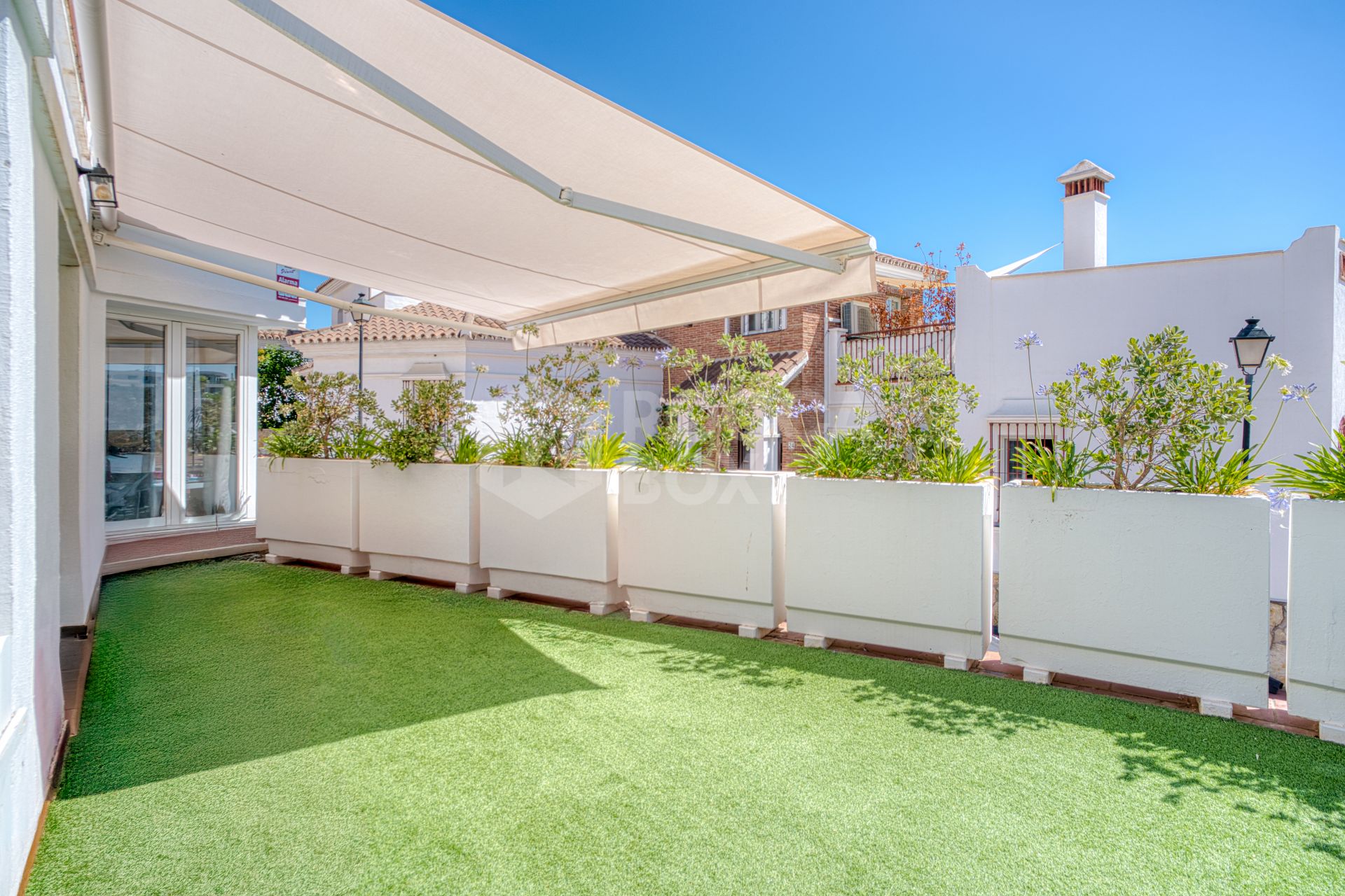 Stylish south west facing, three-bedroom semi detached townhouse located in Riviera del Sol