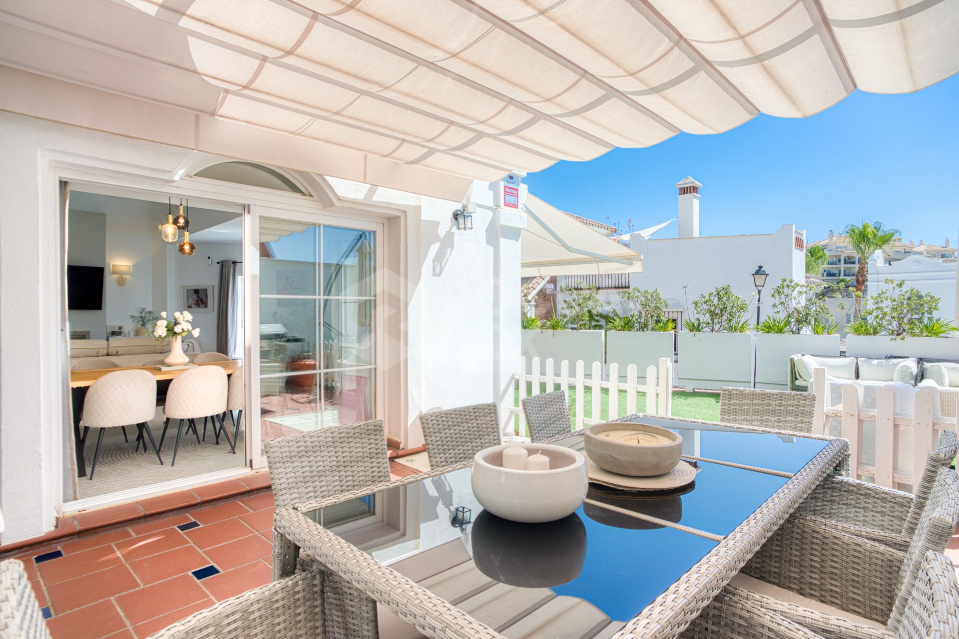 Stylish south west facing, three-bedroom semi detached townhouse located in Riviera del Sol