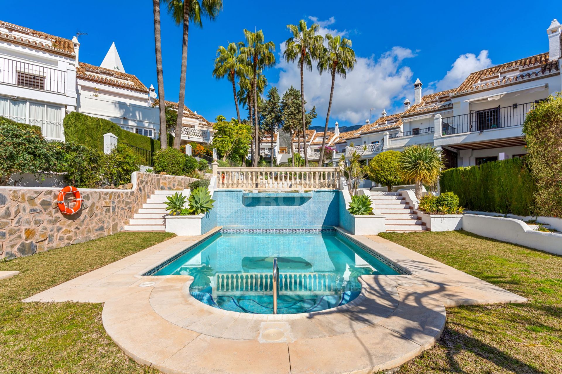 South-facing four-bedroom townhouse located in the gated community of Montepiedra , Nagueles within the Golden Mile, Marbella