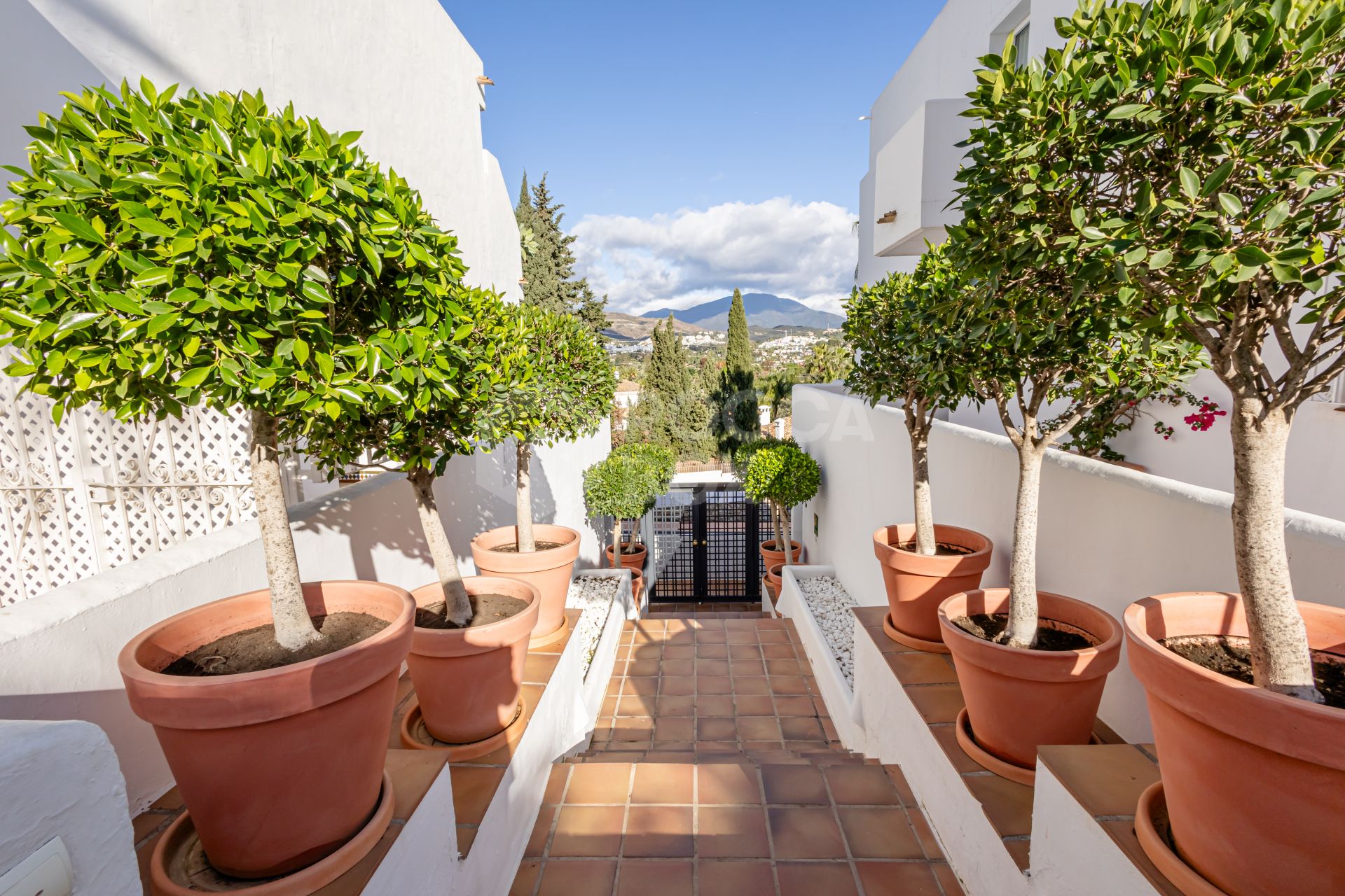 Beautifully reformed two bedroom apartment in the gated community of Jardines de Andalucía, Nueva Andalucia with sea views