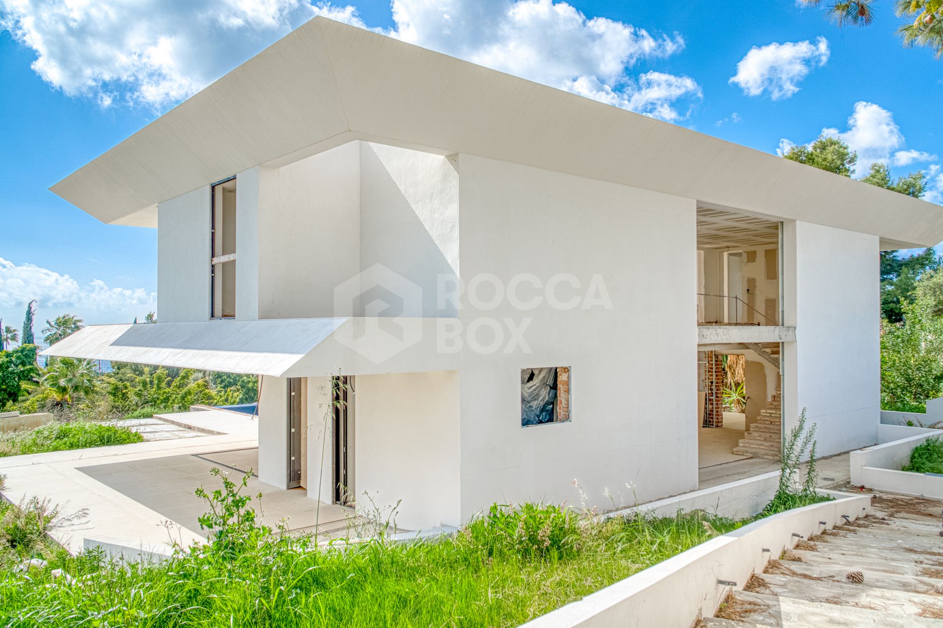 Experience unparalleled luxury with this soon-to-be-completed turnkey villa in the prestigious Hacienda Las Chapas