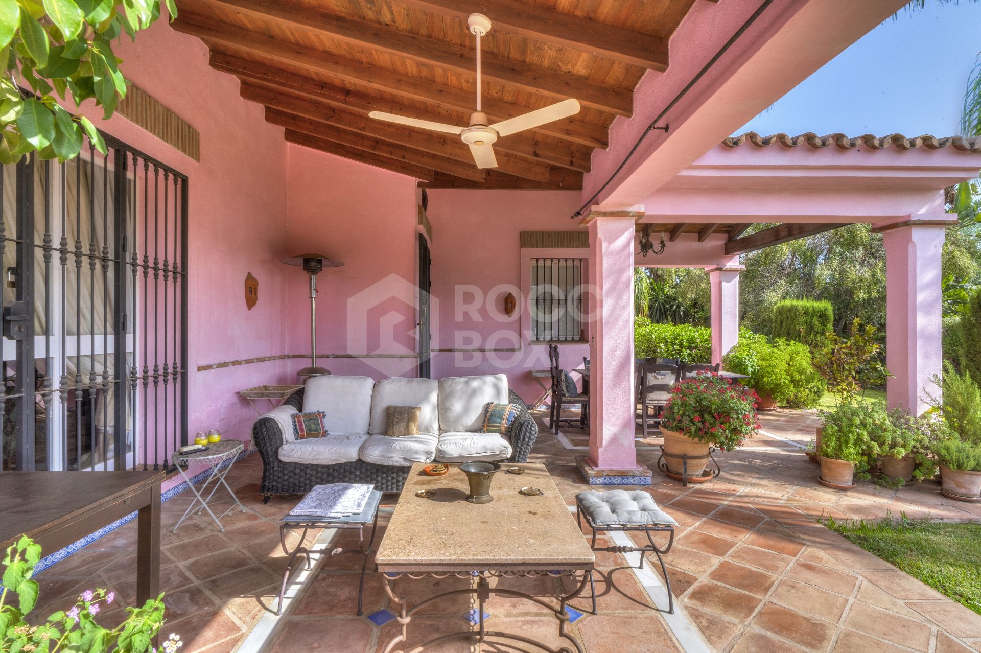 Charming five-bedroom Andalusian style villa in the gated community Puerto de Los Almendros, Benahavis with guest apartment