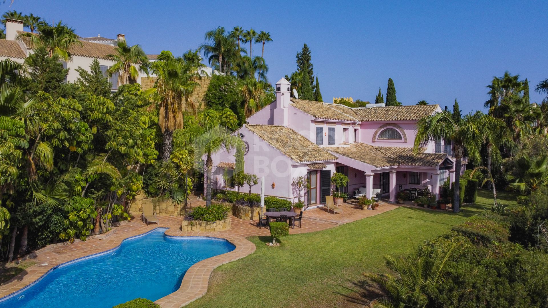 Charming five-bedroom Andalusian style villa in the gated community Puerto de Los Almendros, Benahavis with guest apartment