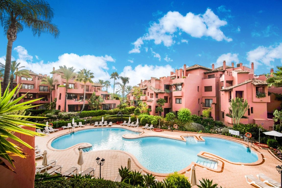 Impressive two bedroom, beach front ground floor apartment located in the luxury gated community of Menara Beach, Estepona.