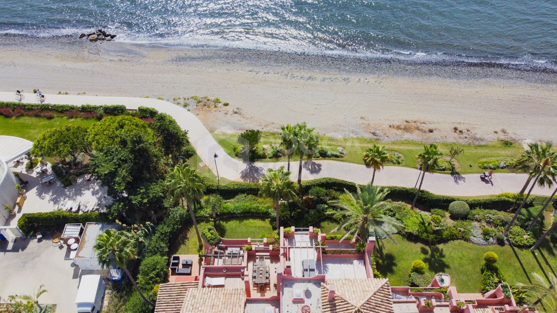 Impressive two bedroom, beach front ground floor apartment located in the luxury gated community of Menara Beach, Estepona.