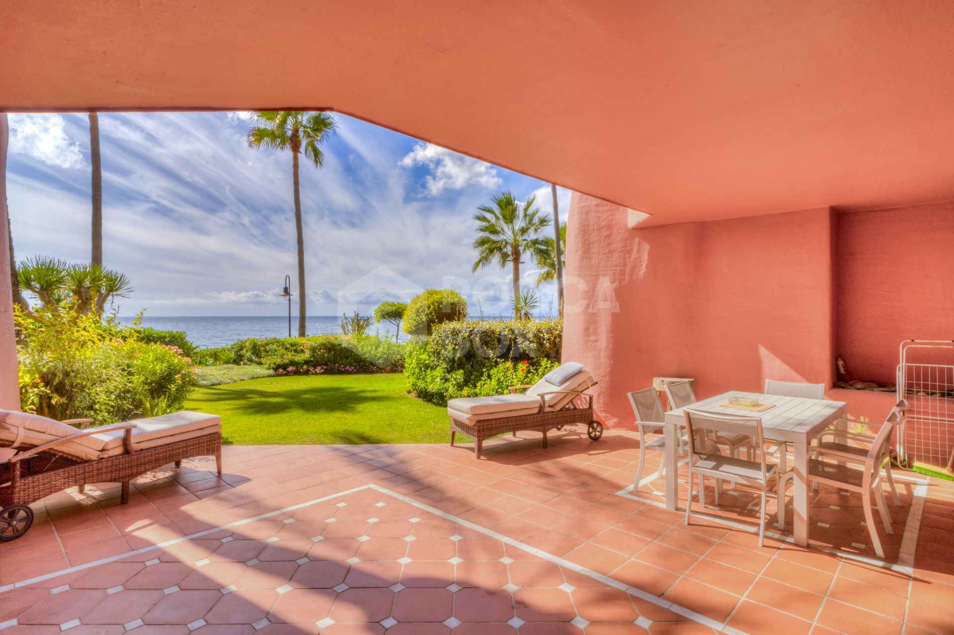 Impressive two bedroom, beach front ground floor apartment located in the luxury gated community of Menara Beach, Estepona.