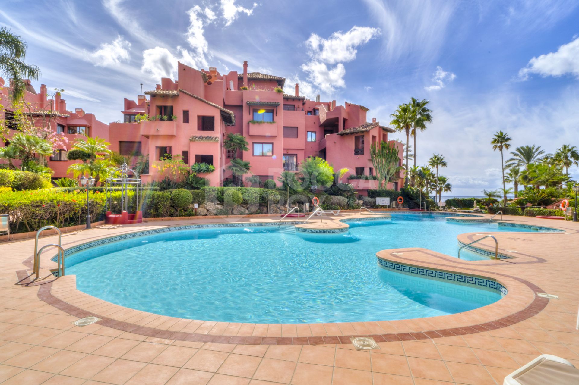 Impressive two bedroom, beach front ground floor apartment located in the luxury gated community of Menara Beach, Estepona.