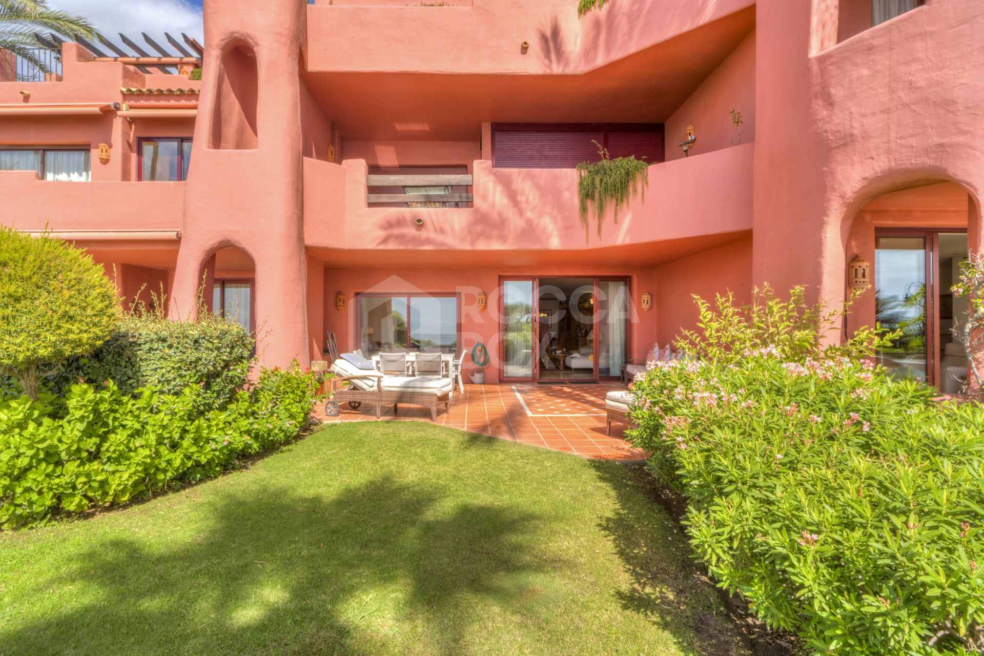 Impressive two bedroom, beach front ground floor apartment located in the luxury gated community of Menara Beach, Estepona.