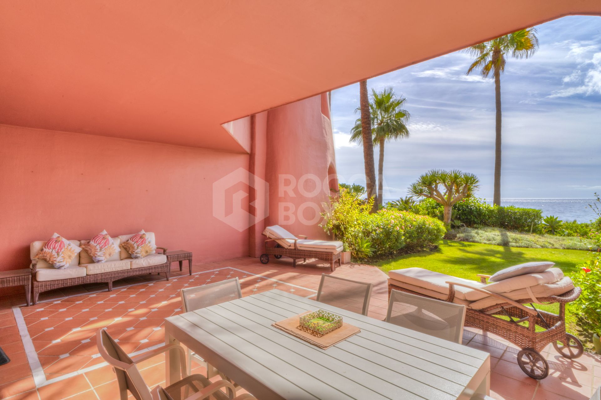 Impressive two bedroom, beach front ground floor apartment located in the luxury gated community of Menara Beach, Estepona.