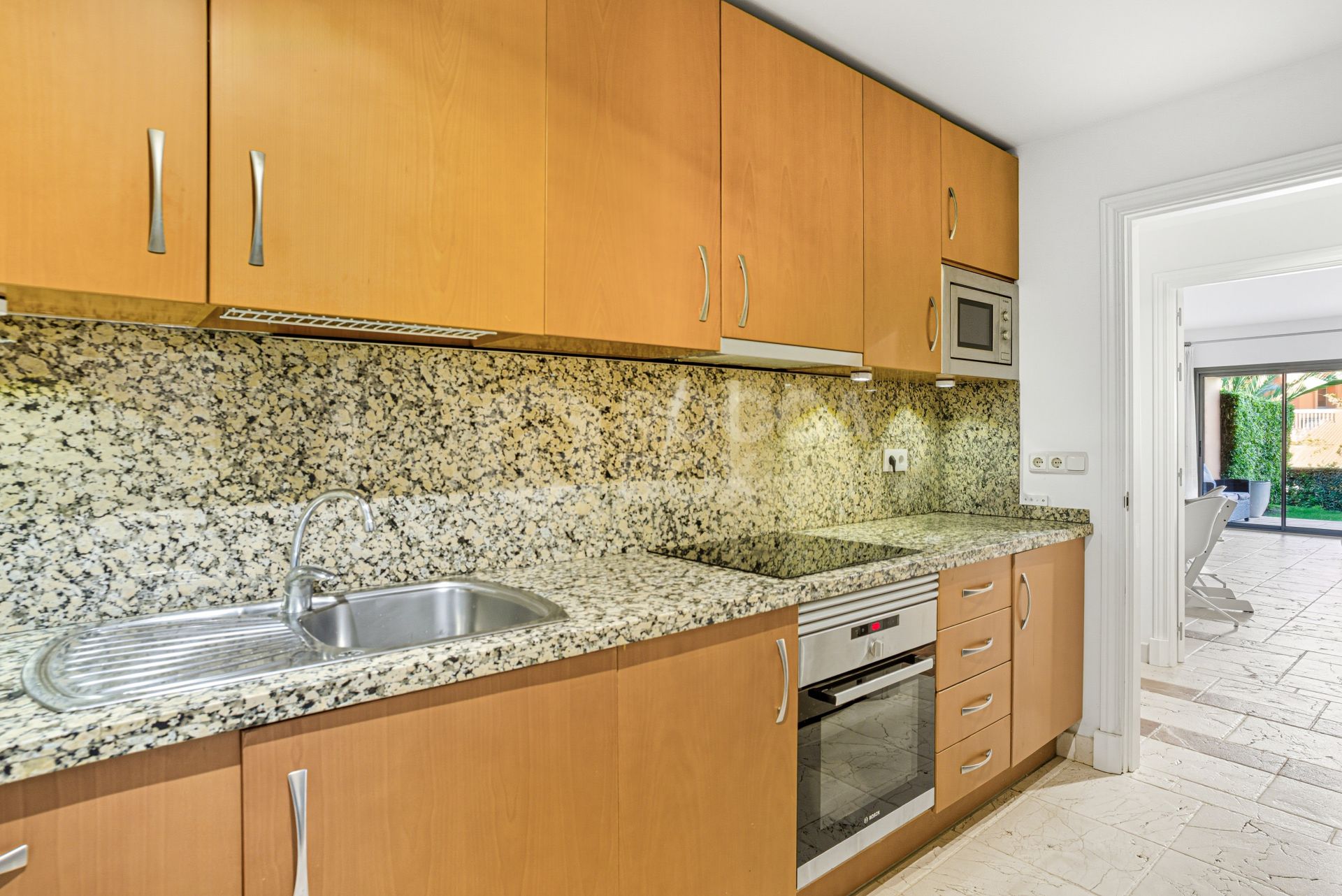 Wonderful two-bedroom, ground floor apartment located in the sought after gated community of Benatalaya