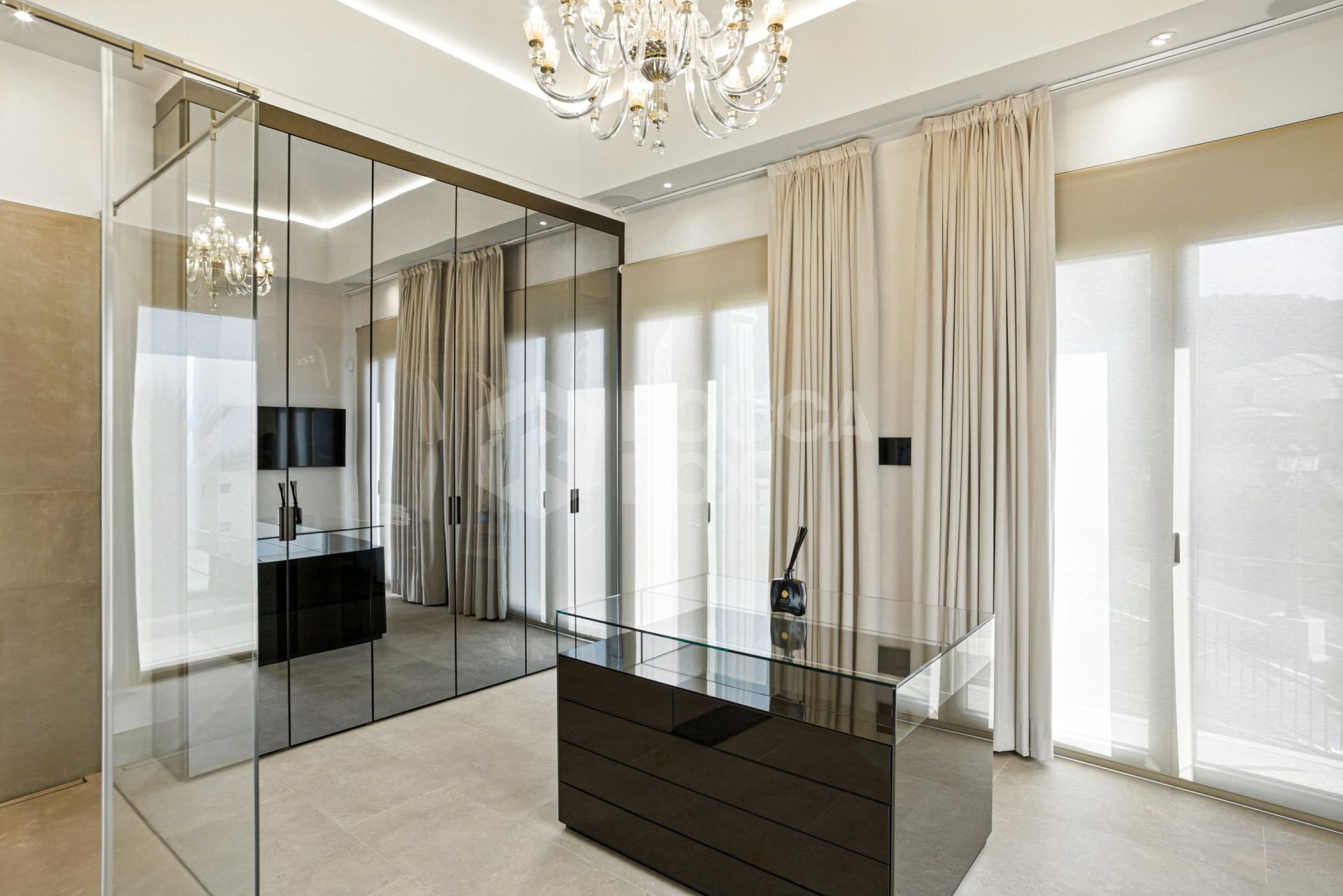 An architecturally unique, south-facing property located in the exclusive gated community of Sierra Blanca on Marbella’s prestigious Golden Mile