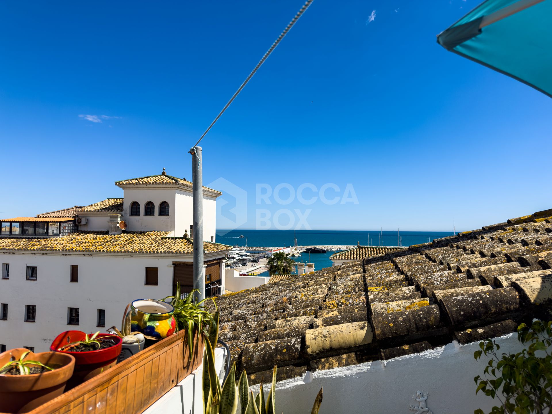 Duplex Penthouse in Puerto de la Duquesa with Partial Sea and Marina Views.