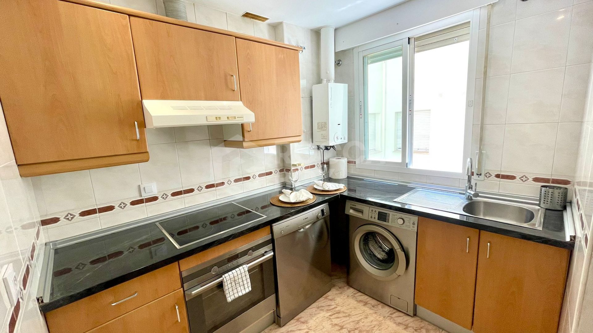 Elegant Two-Bedroom Apartment with Terrace in Prestigious Gated Community