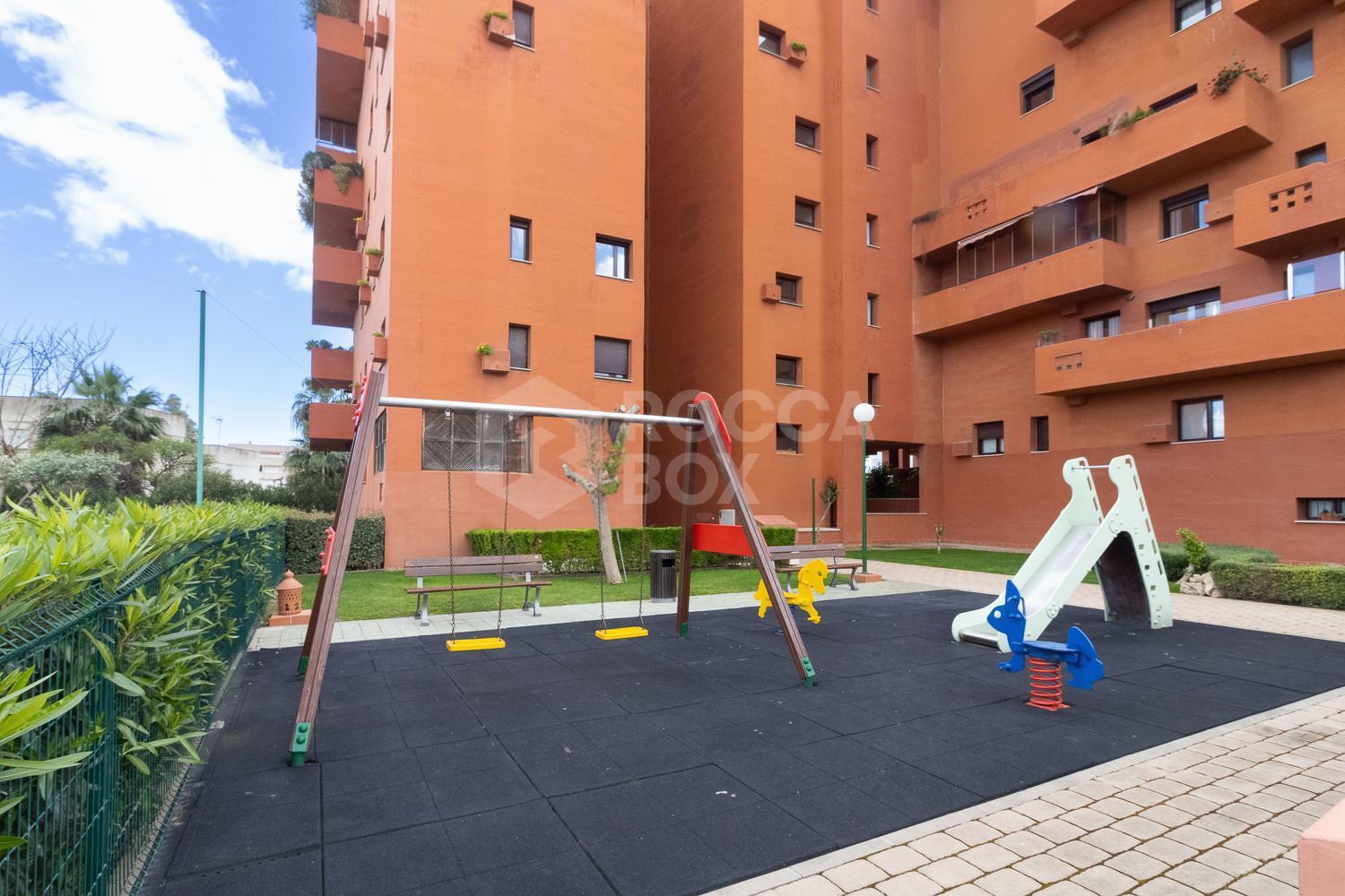 Apartment Steps from Estepona Promenade with Pool & Garden Views