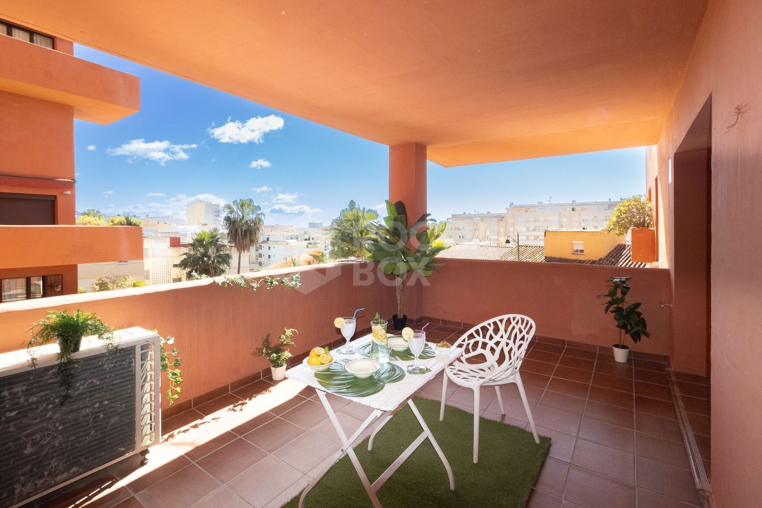 Apartment Steps from Estepona Promenade with Pool & Garden Views