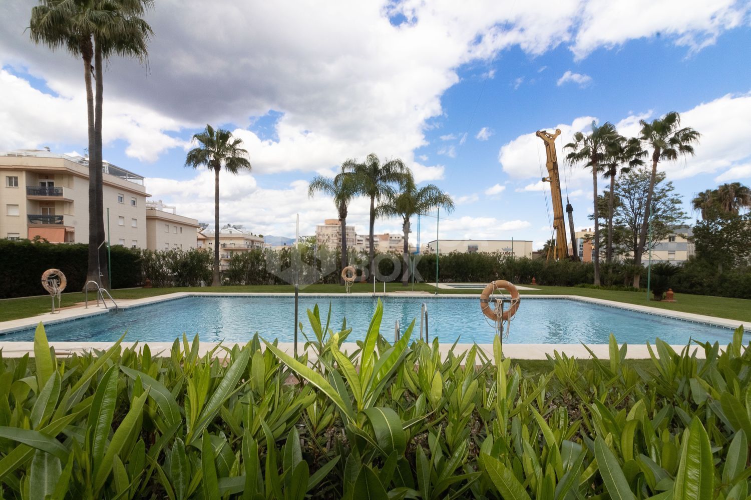 Apartment Steps from Estepona Promenade with Pool & Garden Views