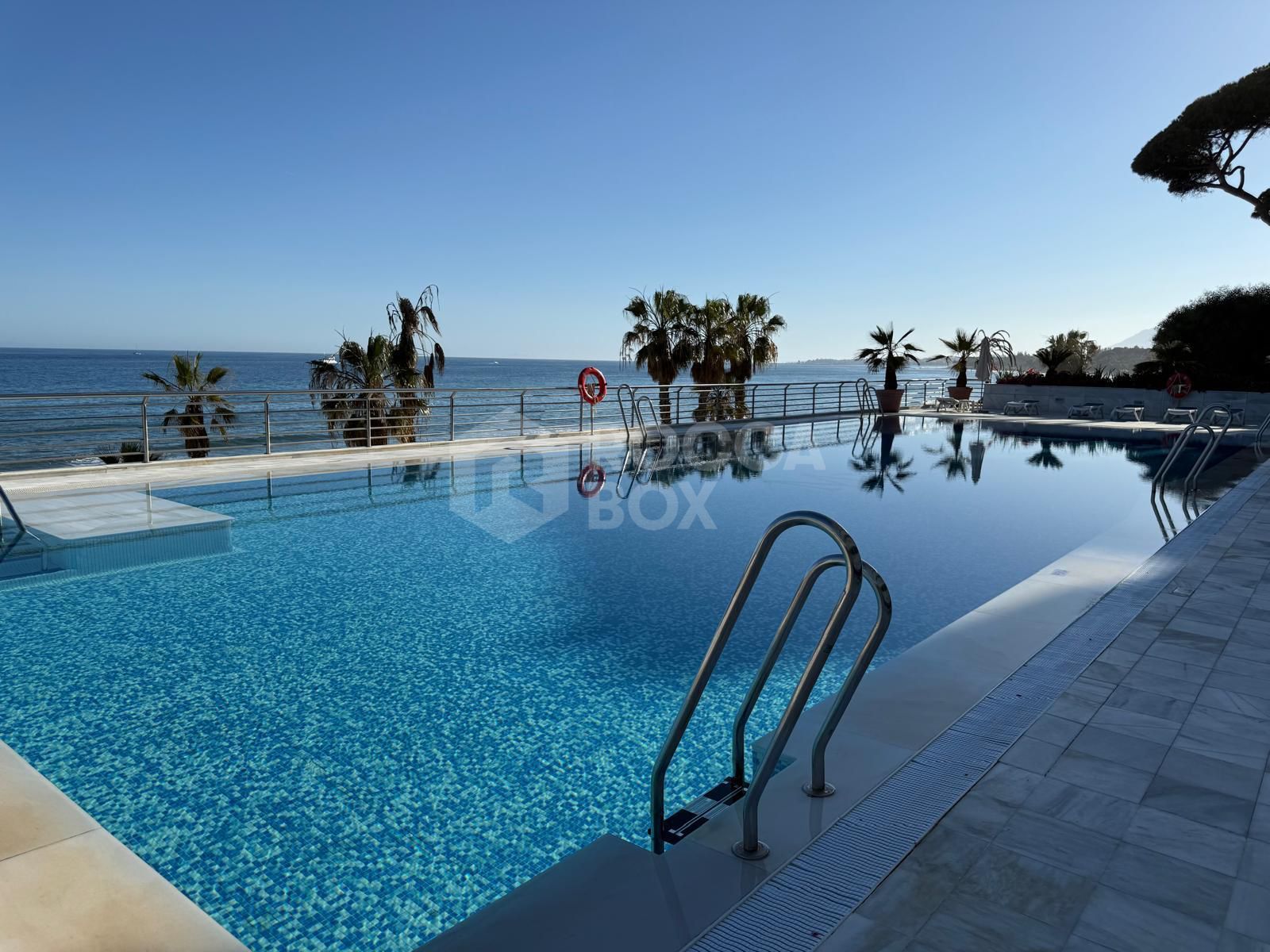 Luxury Beachfront Apartment with Panoramic Views in Prime Location
