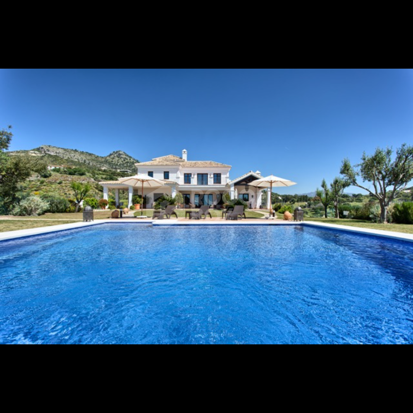 Exquisite Villa with Panoramic Views, Manicured Garden, and Resort-Level Security