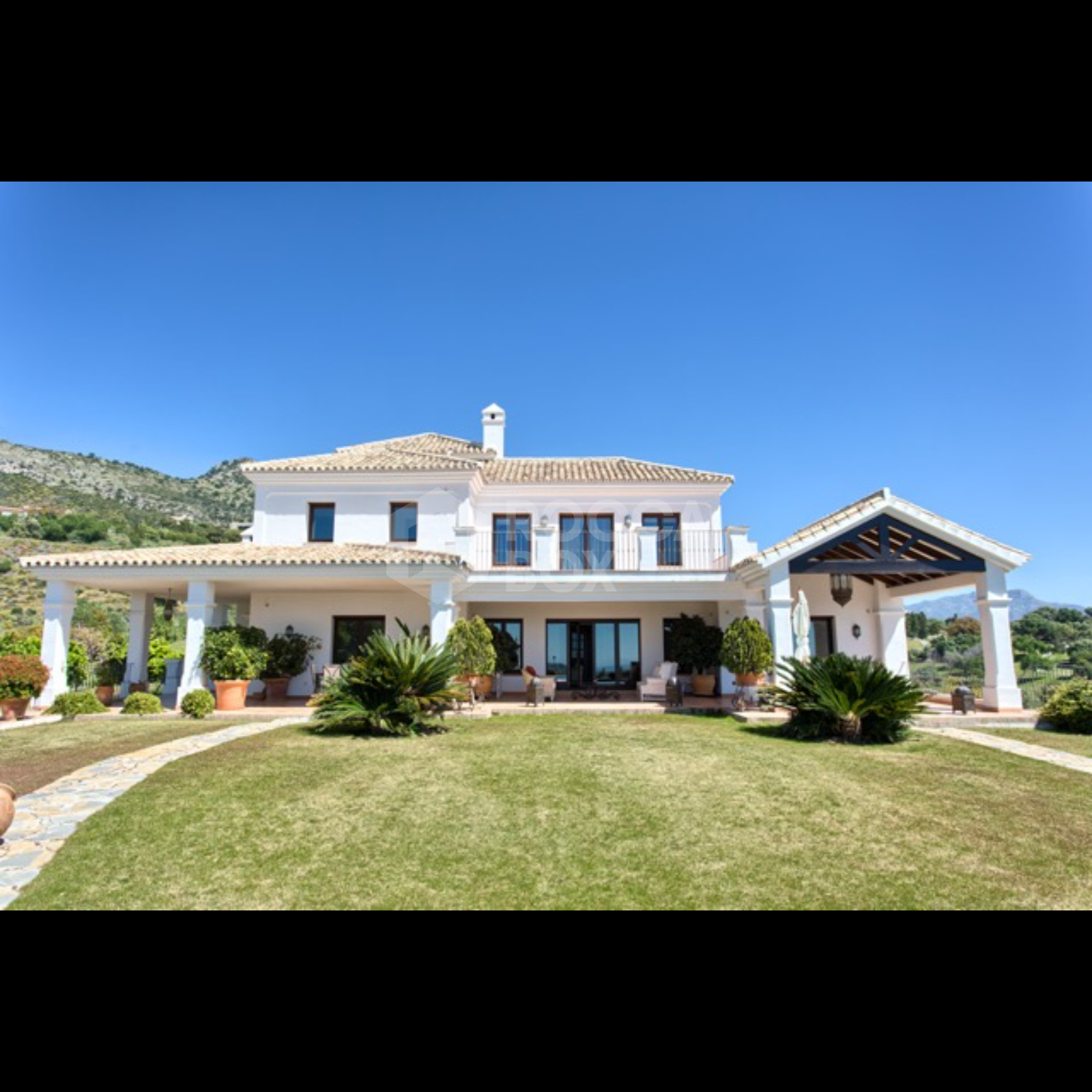 Exquisite Villa with Panoramic Views, Manicured Garden, and Resort-Level Security