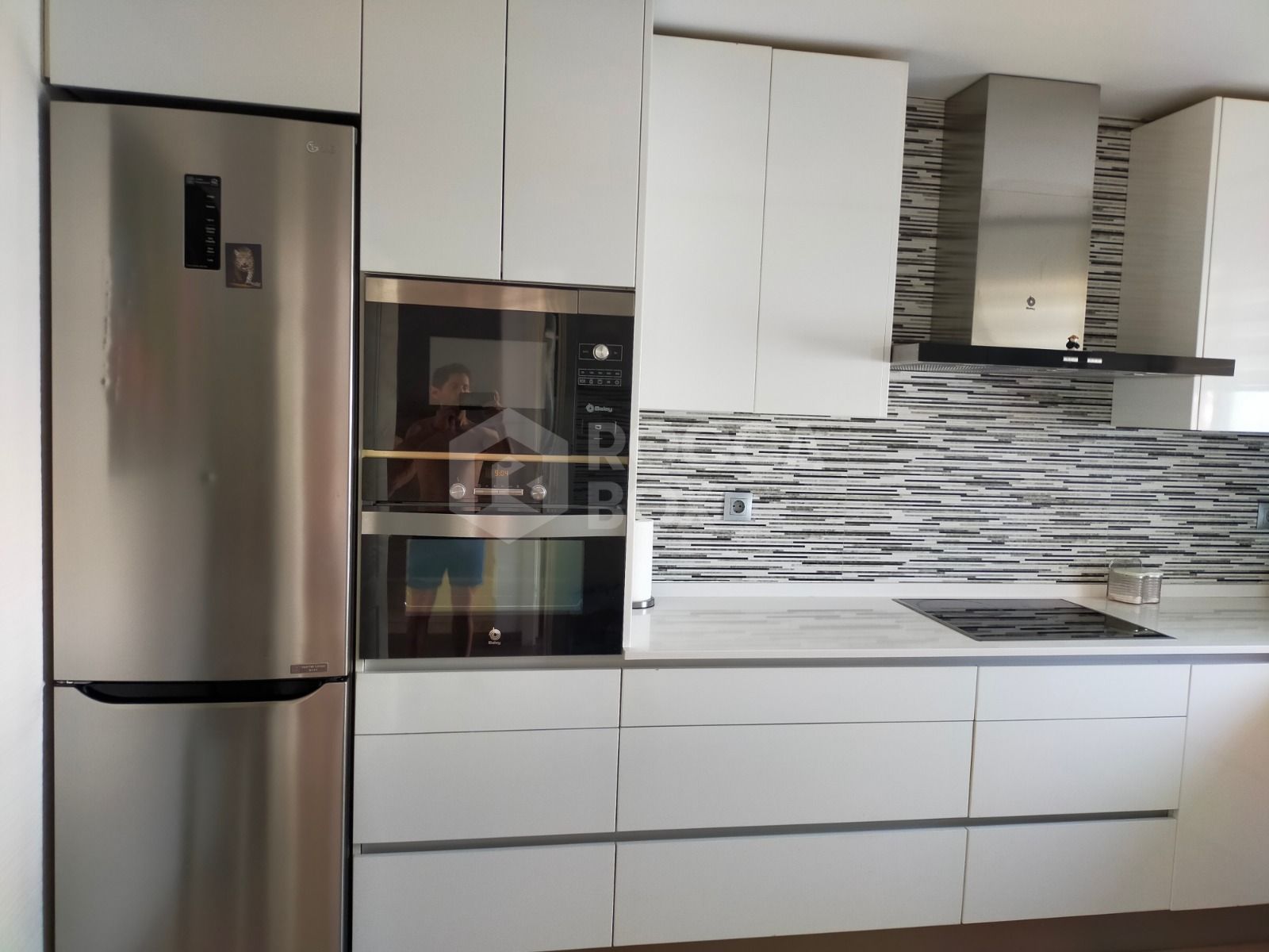 Elegant Three-Bedroom Town House with Private Garage and Communal Pool