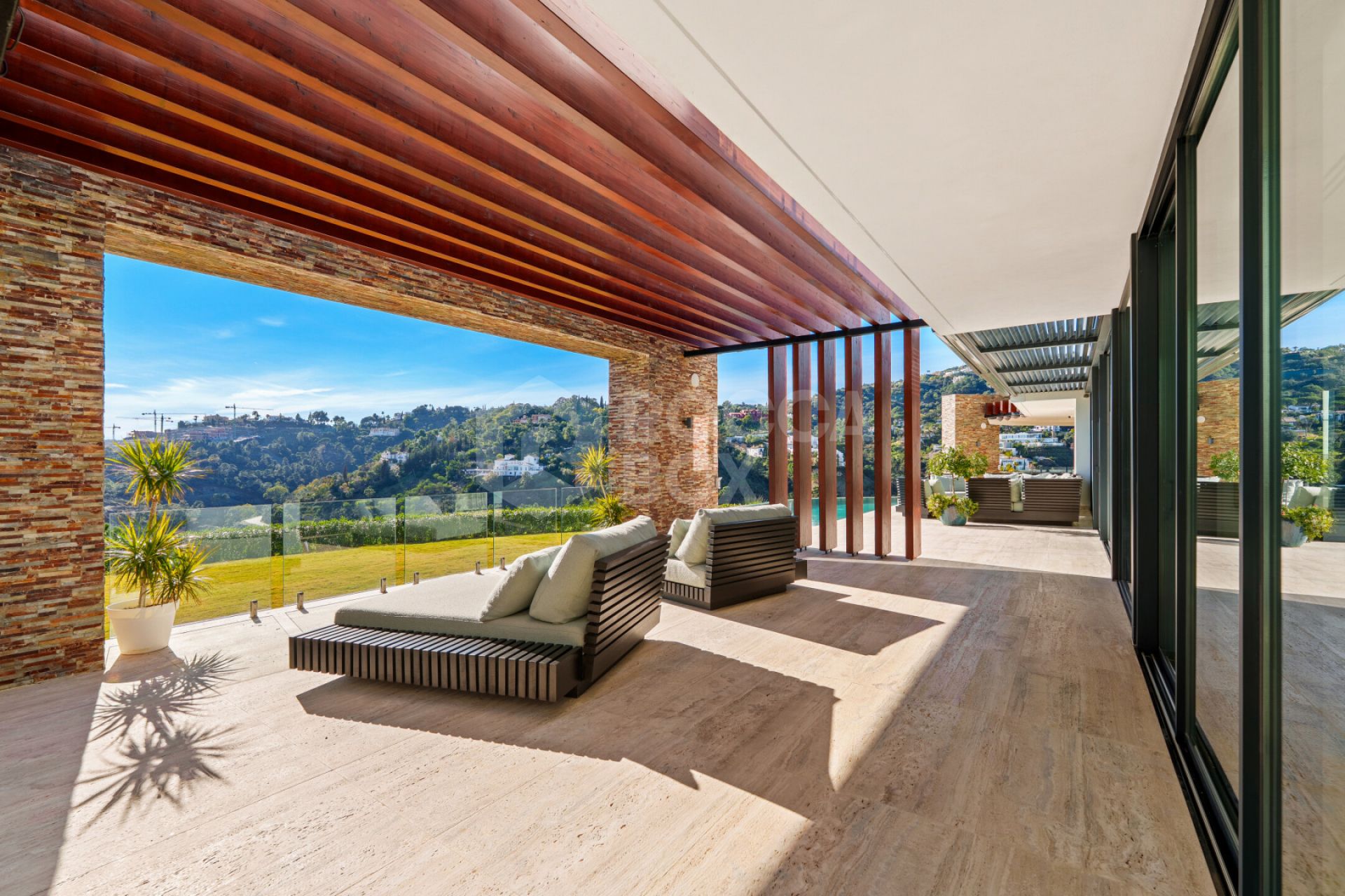 Contemporary Comfort & Privacy Surrounded By Panoramic Andalusian Views in Benahavis.