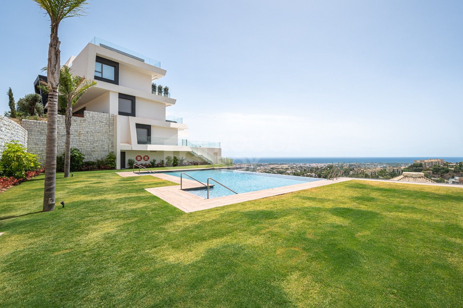Sleek Corner Apartment with Panoramic Golf & Sea Views