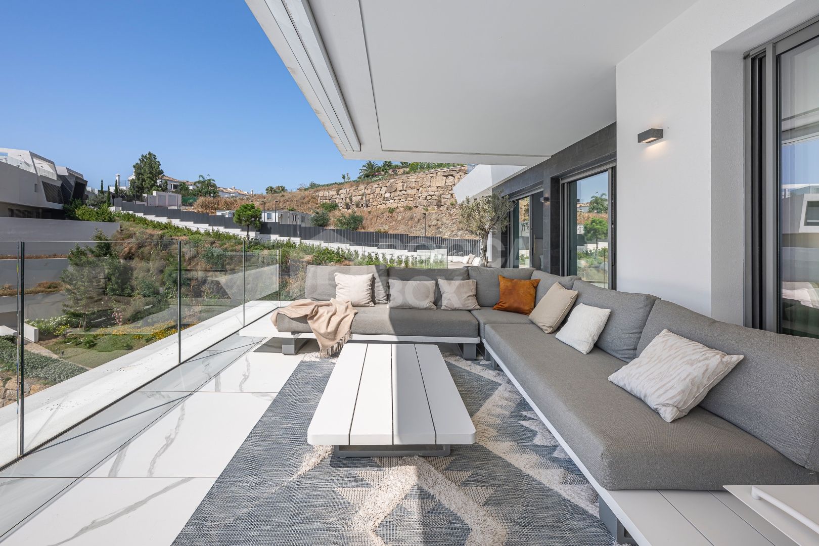 Sleek Corner Apartment with Panoramic Golf & Sea Views