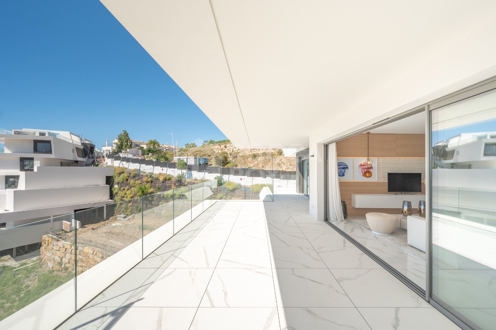 Sleek Corner Apartment with Panoramic Golf & Sea Views