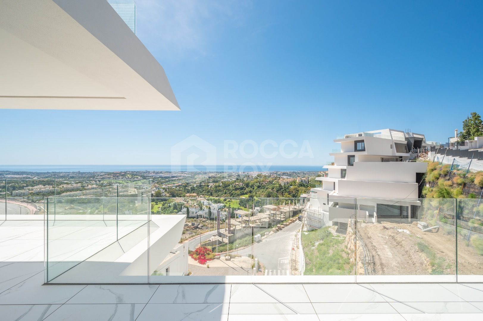 Sleek Corner Apartment with Panoramic Golf & Sea Views
