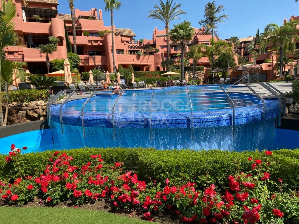 Luxurious Ground Floor Apartment in Torre Bermeja, Estepona: Beachfront Living with Unparalleled Amenities