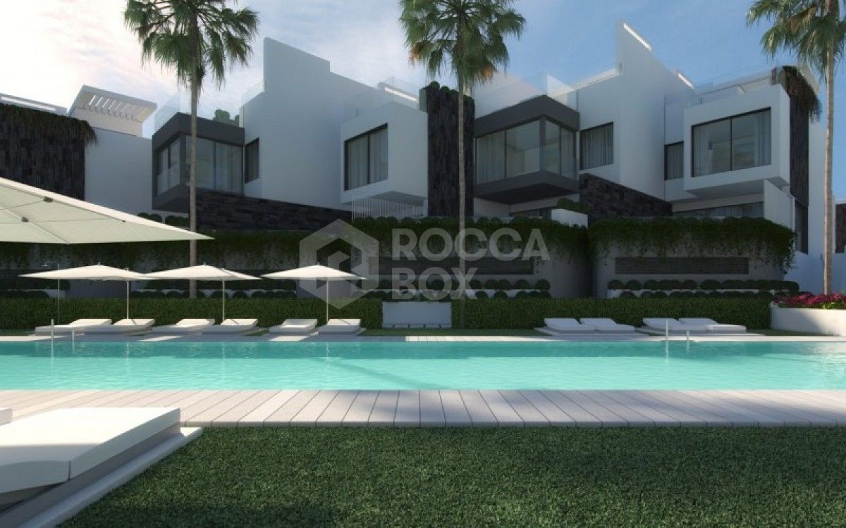 Exclusive contemporary style 1st line beach townhouse setting in Estepona